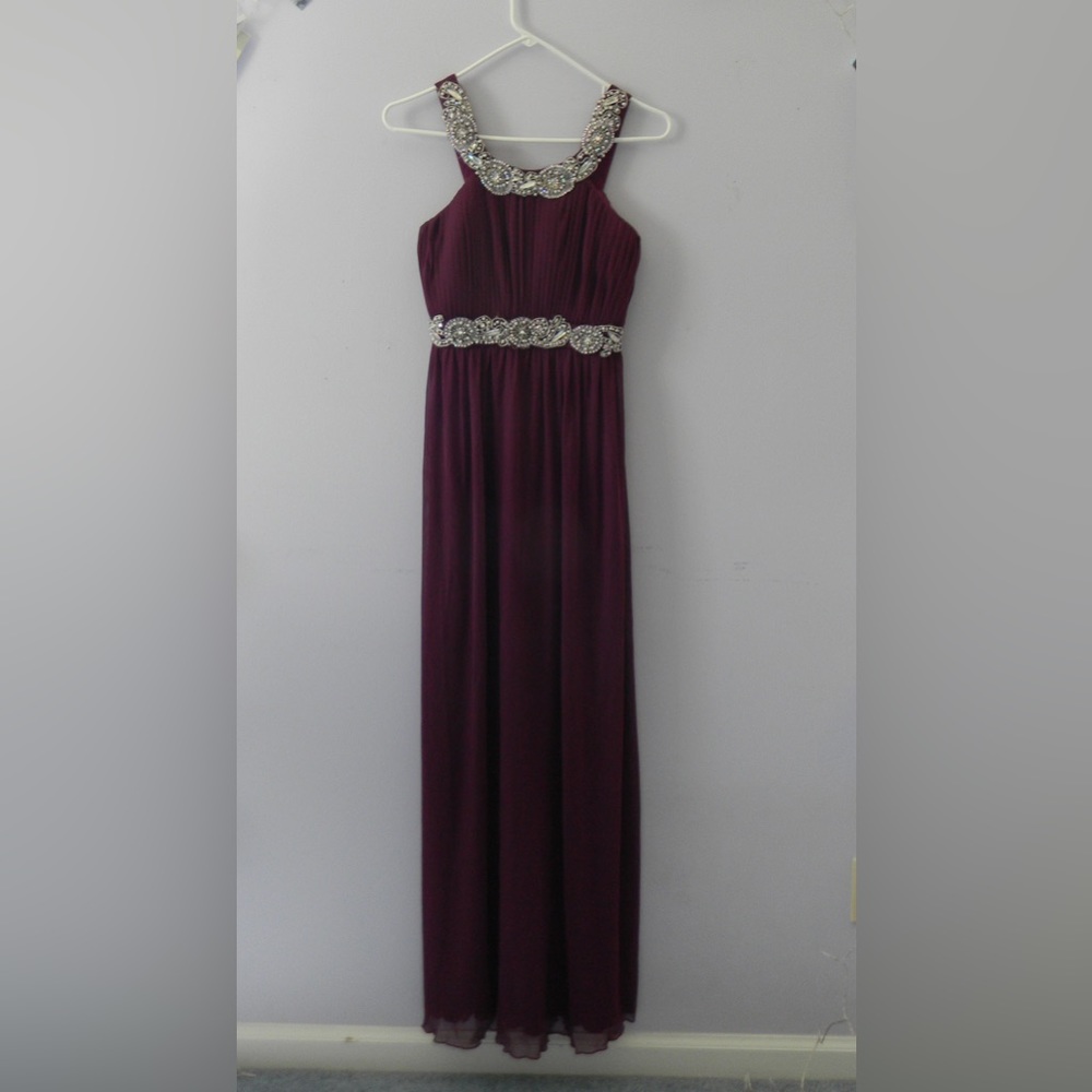 Beautiful plum color prom dress with bejeweled neck and waist